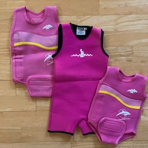 Gently used set of three baby wetsuits in pink